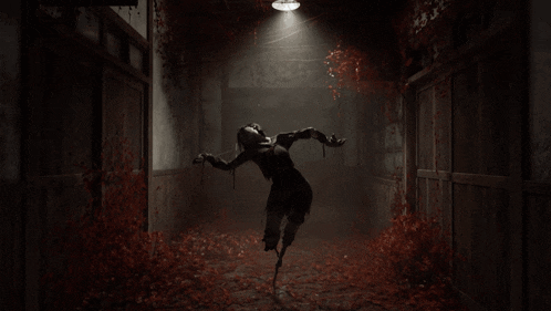 a woman in a black dress is flying through a dark hallway with red leaves on the floor