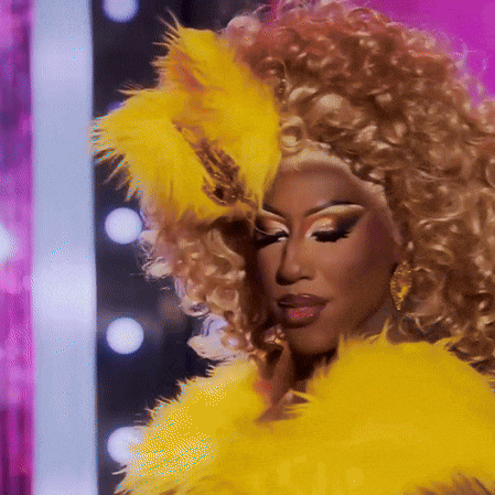 a close up of a woman wearing a yellow boa