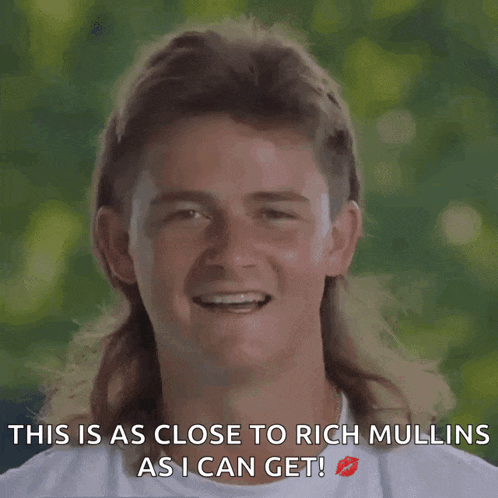 a man with a mullet is smiling with the words " this is as close to rich mullins as i can get "