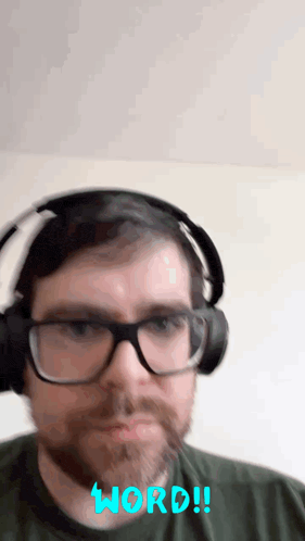 a man wearing glasses and headphones has the word word written in blue