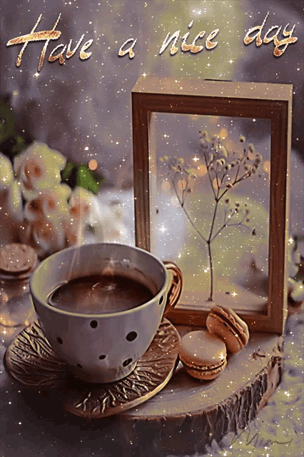 a cup of coffee sits on a saucer next to a framed picture that says have a nice day