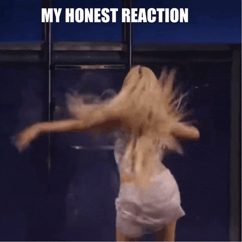 a woman is dancing on a stage with a microphone in her hand and the words `` my honest reaction '' above her .