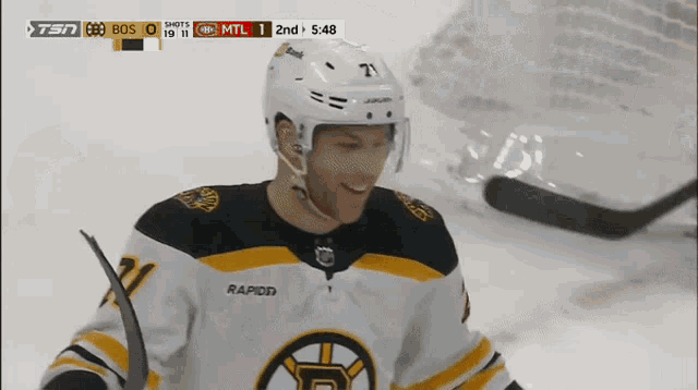 a hockey player wearing a jersey that says rapid on the back