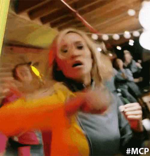 a woman is dancing in a room with the hashtag #mcp on the bottom left