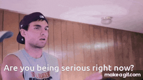 a man wearing a baseball cap and a tank top says " are you being serious right now ? "