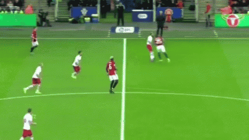a group of soccer players are playing on a field with an ad for lg in the background