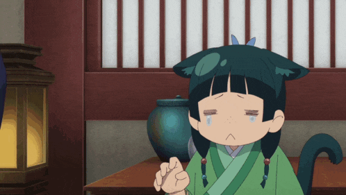 a cartoon character with a cat ear and a green robe