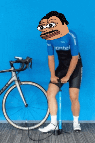 a man wearing a blue shirt that says mantel pumps his bicycle