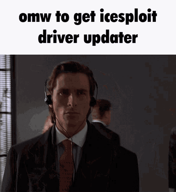 a man in a suit and tie wearing headphones with the caption omw to get icesploit driver updater