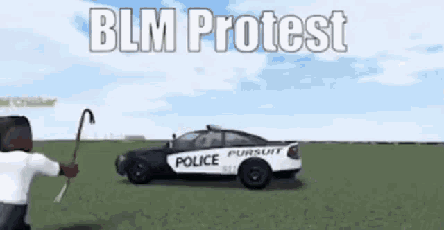 a black man is kneeling in front of a police car with the words blm protest written on it .