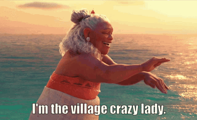 a woman standing in the ocean with the words i 'm the village crazy lady