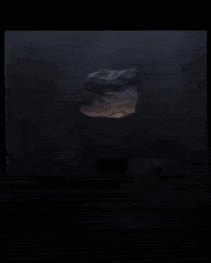 a large rock is being smashed into a pile of rocks