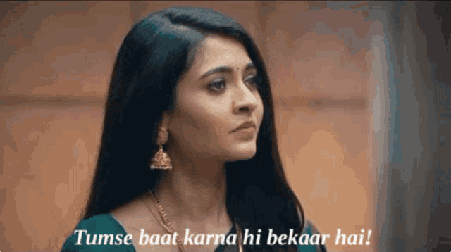 a woman in a green saree says tumse baat karna hi bekaar hai !