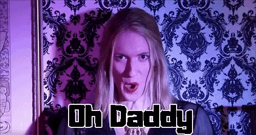 a woman says oh daddy in front of a purple background