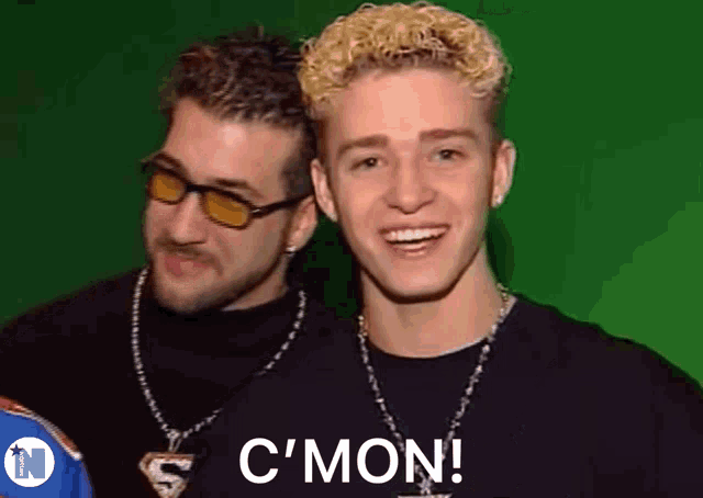 two young men are posing for a picture and one of them says c ' mon !