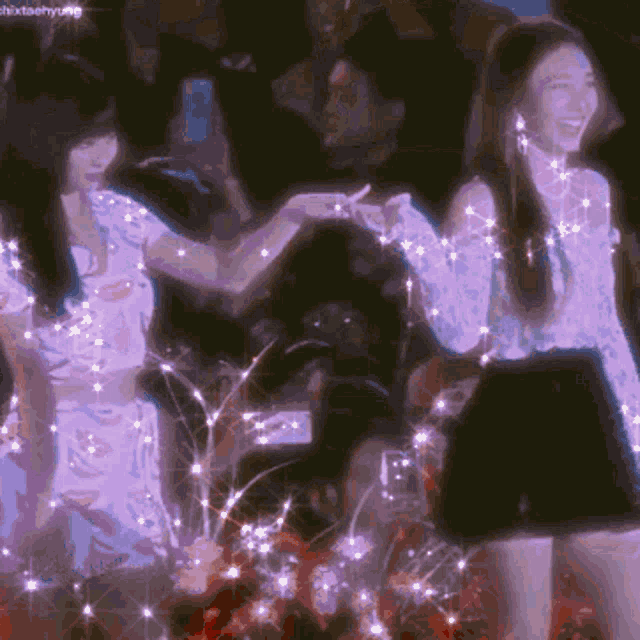 two women are standing next to each other in a dark room with a watermark that says shixtaehyun