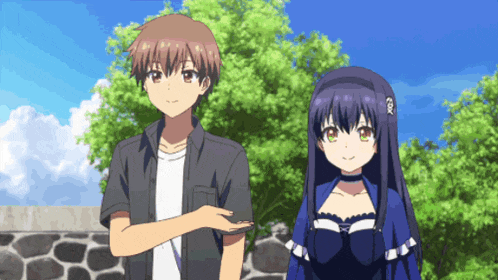 a boy and a girl standing next to each other