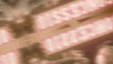 a blurred image of a pink sign that says ' i love you ' on it
