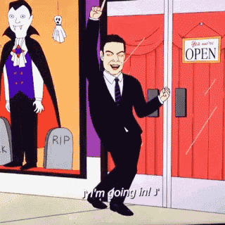a man in a suit and tie is standing in front of an open sign