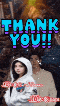 a couple standing next to each other with the words thank you written in blue