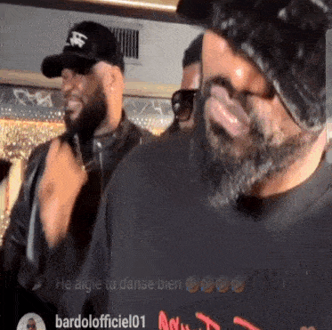 a man with a beard is wearing a black shirt that says bardolofficiel01 on it