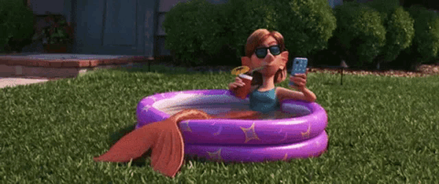 a woman is laying in an inflatable pool taking a picture of herself