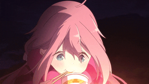 a girl with pink hair and blue eyes is eating noodles with chopsticks