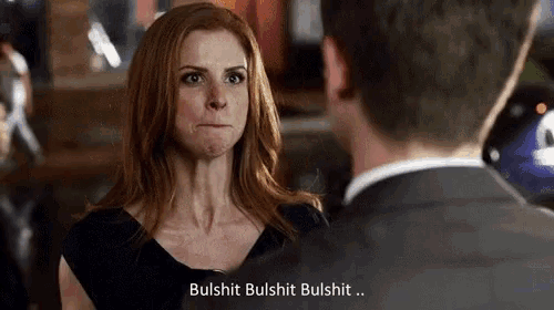 a man and a woman are looking at each other and the woman is saying bulshit bulshit bulshit ..
