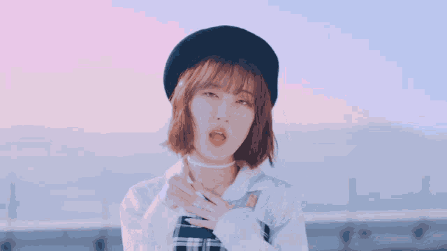 a girl wearing a beret and a white shirt