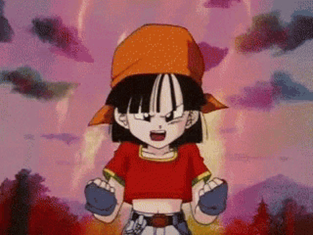 a girl in a red shirt and orange hat is standing in front of a pink background