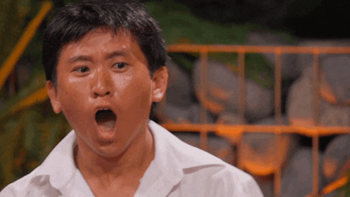 a man making a surprised face with his mouth wide open