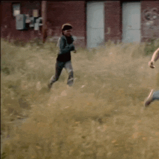 a blurry picture of a person running in a field .