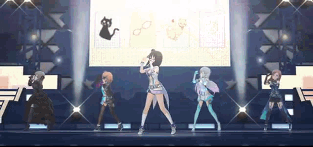 a group of anime girls are dancing on a stage in front of a screen .