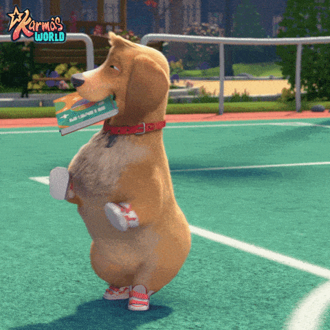 a dog standing on its hind legs with a book in its mouth and the words karma 's world on the bottom