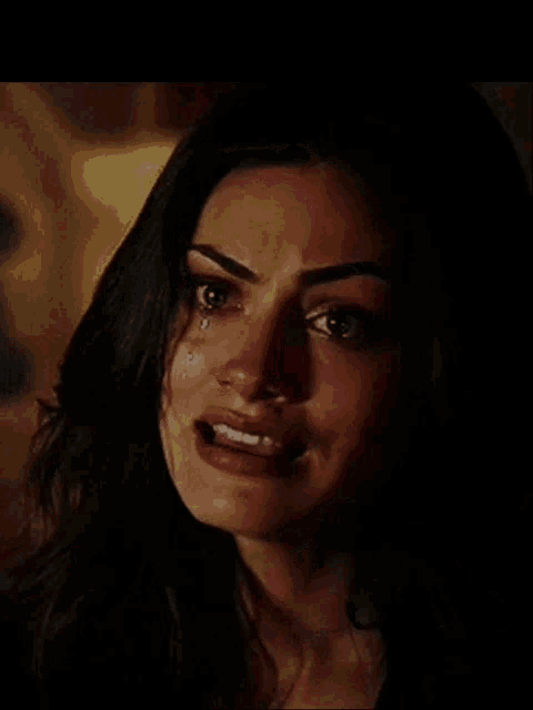 a woman with tears coming out of her eyes
