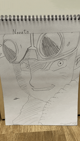 a drawing of naruto is on a spiral bound piece of paper