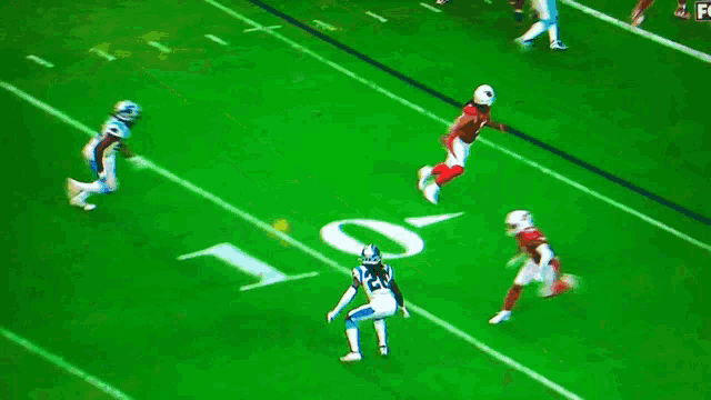 a football game is being played on a field with the numbers 20 and 10 visible