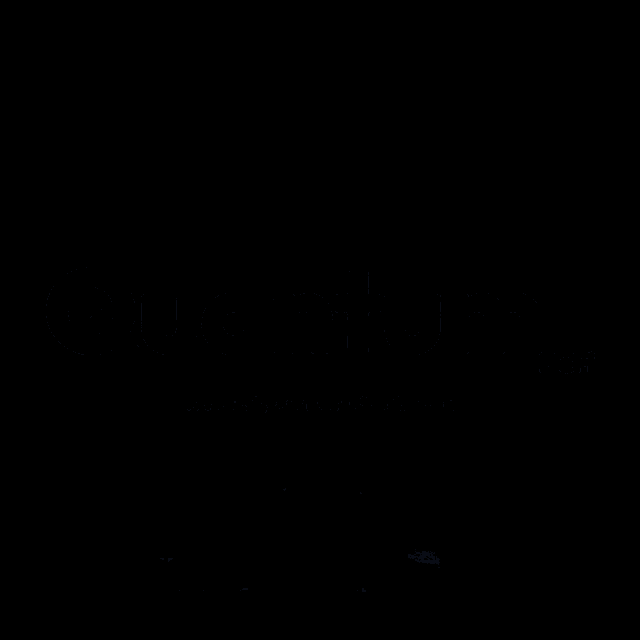 a glowing object in the dark with a blue light coming out of the center