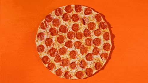 a pepperoni pizza that has been cut into slices on an orange background