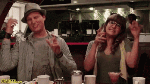 a man and a woman dancing in a diner with cracked.com written on the bottom right