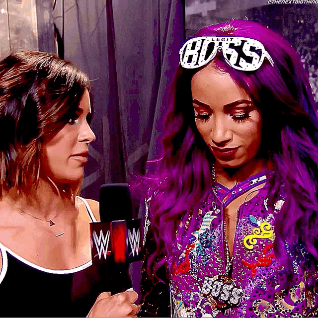 a woman with purple hair is wearing sunglasses that say boss
