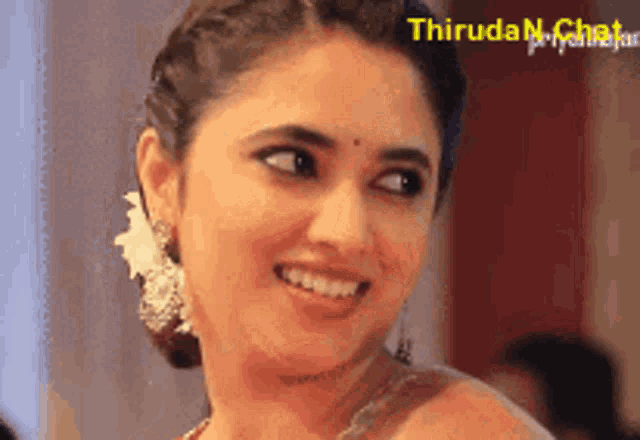 a close up of a woman 's face with the words " thiruda priyanka " on the bottom right