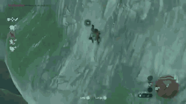 a video game is being played on a computer and a person is standing on a cliff .