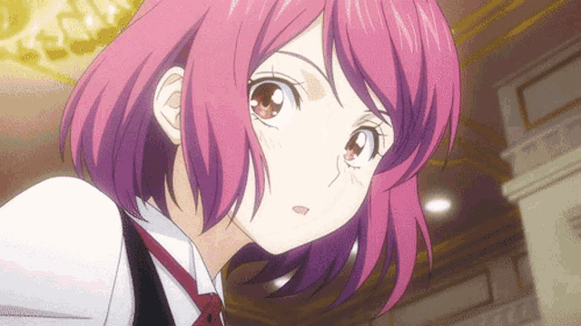 a girl with pink hair is wearing a white shirt and a black vest