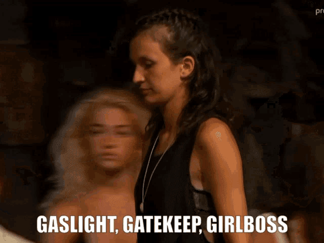 a woman says gaslight gatekeep girlboss in a crowd
