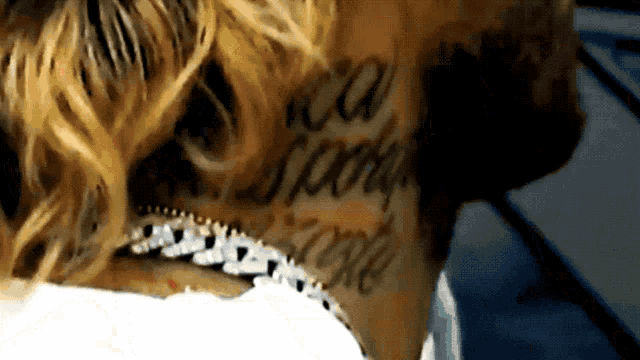 a close up of a person 's neck with a tattoo that says ' i am sorry i love '