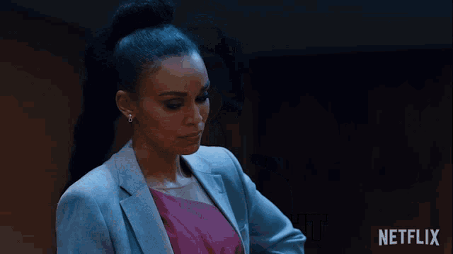 a woman in a suit says " goodnight " in a netflix ad