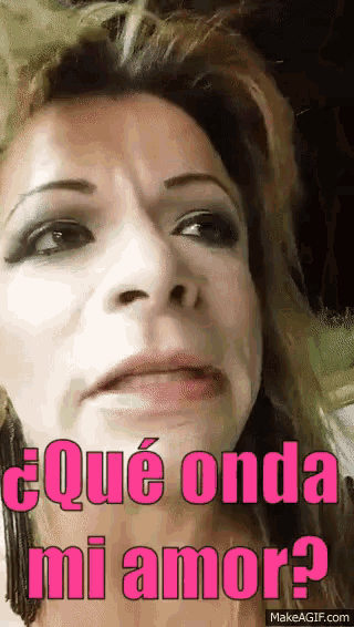 a close up of a woman 's face with the words qué onda mi amor