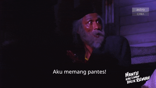 a man with a beard is on a screen that says astro citra
