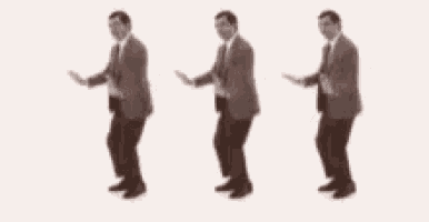 three men in suits and ties are dancing in a line .